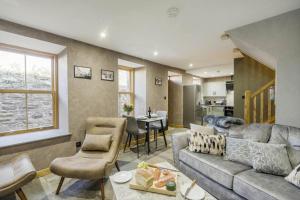 a living room with a couch and a table at 1 Bed in Banff oc-t42474 in Banff