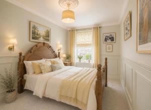 a bedroom with a large bed and a window at 5 Bed in Hundleby oc-o44769 in Spilsby