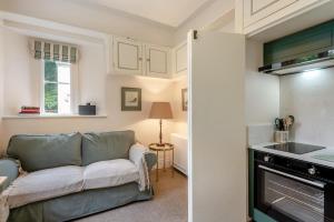 a living room with a couch and a kitchen at 1 Bed in Exton oc-e42799 in Exton