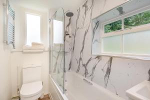 a bathroom with a shower and a toilet and a sink at 1 Bed in Exton oc-e42799 in Exton +11 photos