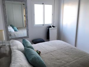 Posteľ alebo postele v izbe v ubytovaní Apartamento Rialto