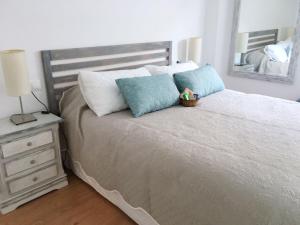 Posteľ alebo postele v izbe v ubytovaní Apartamento Rialto