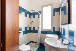 a bathroom with a toilet and a sink at House&Villas - Residence Miramare in Avola +46 photos