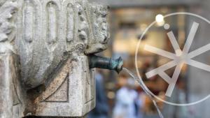 a stone statue with a pipe sticking out at Hôtel des ARTS Aix in Aix-en-Provence