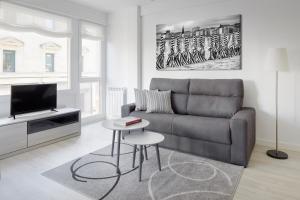 Televízia a/alebo spoločenská miestnosť v ubytovaní Fuenterrabia by FeelFree Rentals