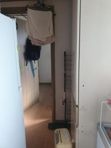 a room with a closet with a door and a room with a door at 1room 1bed Gangnam in Samgong