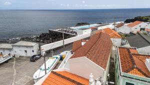 a view of the ocean from the roof of a building at Casa do Porto - Santa Cruz B&B in Ribeiras +108 photos