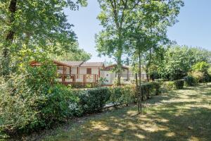 a house with trees in front of it at Azur de La Cigale -Conciergerieland in Azur