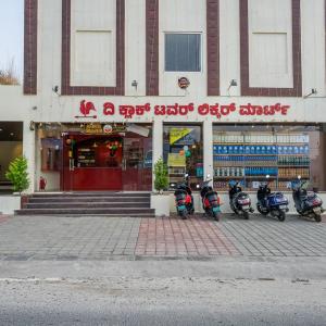 a group of motorcycles parked in front of a building at The Clock Tower Inn in Bangalore