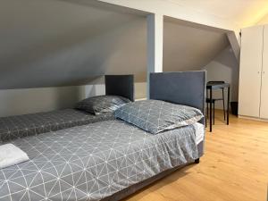 a bedroom with two beds in a room at Horiza in Gdańsk