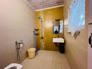 a bathroom with a sink and a shower and a toilet at Haven Daisy Meadows - 2BR Cottage with Lawn in Changla Gali in Chhāngla Gali +11 photos
