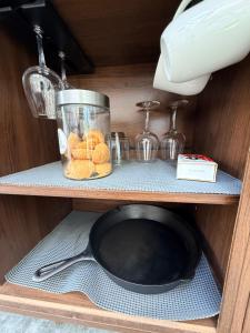 a shelf with a blender and some food in it at Dome Haven Glamping in South Haven