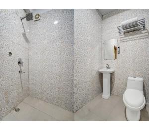 a bathroom with a toilet and a shower at Royal with - Group Name Hotel Double R- comfort stay in Main Bazar New Delhi in New Delhi