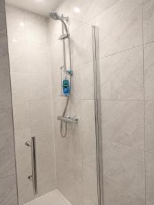 a shower with a glass door in a bathroom at Cinderhouse Highbury Vale in Nottingham +68 photos
