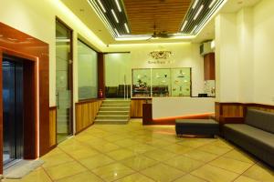 a lobby of a store with a couch and a table at The Marwar regency Hotel in Jodhpur