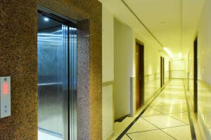 an elevator in a building with a hallway at The Marwar regency Hotel in Jodhpur