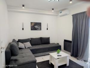 a living room with a couch and a table at Holiday home Vodice in Vodice