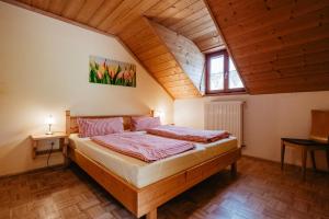 a bedroom with a bed in a attic at Balsnhof in Chamerau