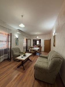 a living room with a couch and a table at Apartments Vukasović in Kotor