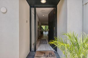 a hallway of a house with a mirror and plants at 1205 Lagoon Villas in Amelia Island