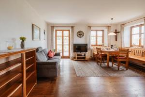 a living room with a couch and a table at Balsnhof in Chamerau