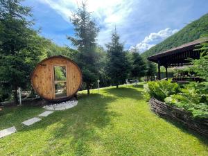 a small wooden building in a field of grass at Cabana Carolina in Laz +73 photos