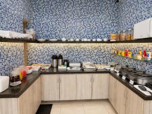 a kitchen with a counter with food on it at Pousada Planalto in Juazeiro do Norte