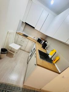 an overhead view of a kitchen with white cabinets at 1apartment on First Line-Bosteri in Bosteri +2 photos