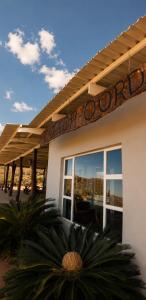 a sign on the side of a building at Katkop Resort in Graafwater