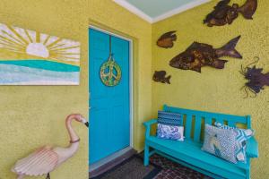 a room with a blue door and a blue bench at 115 South Fletcher in Fernandina Beach