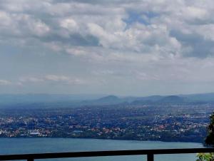a view of a city and a body of water at RUBONA HILL Lodge in Gisenyi
