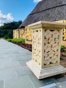 a sculpture of a pile of food in front of a building at N'taba River Lodge & Spa in Port St. Johns