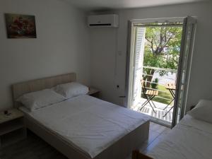 Posteľ alebo postele v izbe v ubytovaní House Mima