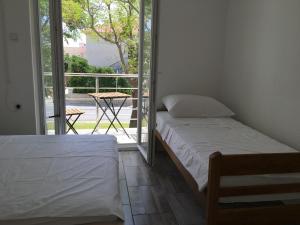 Posteľ alebo postele v izbe v ubytovaní House Mima