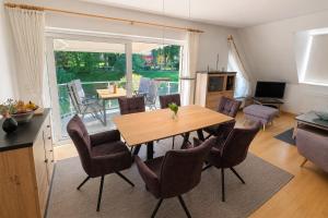 a kitchen and dining room with a table and chairs at Casa Claudio in Plau am See