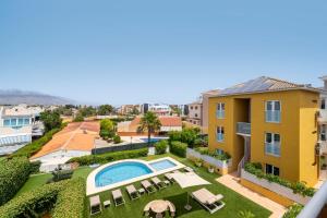 a view of the backyard of a house with a swimming pool at Albir Experience in Albir