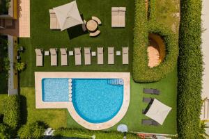 an overhead view of a swimming pool and yard at Albir Experience in Albir