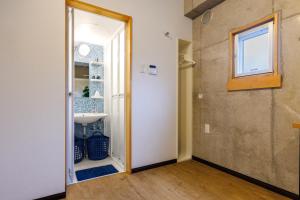 a bathroom with a sink and a mirror at Kokusai Street Garden Hotel in Naha +43 photos