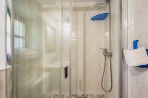 a bathroom with a shower with a glass door at Casa Engracita in Valle de Lago +43 photos