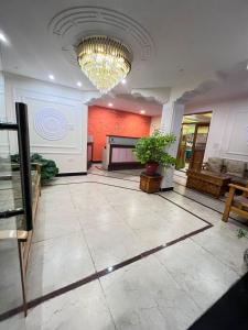 a large lobby with a chandelier in a building at Hotel Om Ladakh in Leh