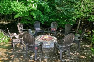 a group of chairs around a table with a fire place at Inn Like a Lamb in South Haven