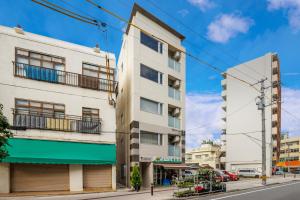 an apartment building on a city street at Kokusai Street Garden Hotel in Naha