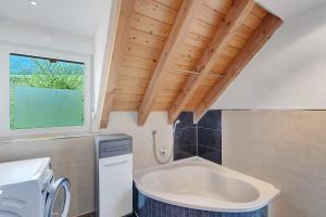 a small bathroom with a sink and a window at Ferienwohnung Joosenhof in Winden im Elztal