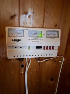 a stack of boxes hanging on a wall at Simple and cozy forest cabin in Eidsstryken