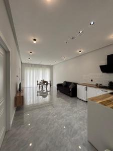 a large living room with a couch and a table at Shahdag Mountain Breeze in Qusar