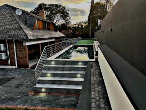 a set of stairs in front of a house at Victoria City Lodge in Pretoria