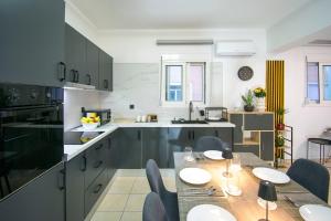 a kitchen with a table and chairs in a kitchen at Gennadi Escape House in Gennadi