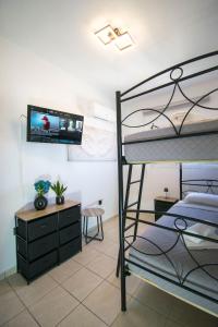 a bedroom with a bunk bed and a desk at Gennadi Escape House in Gennadi