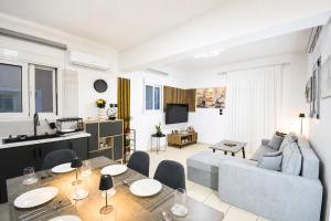 a living room with a couch and a table at Gennadi Escape House in Gennadi