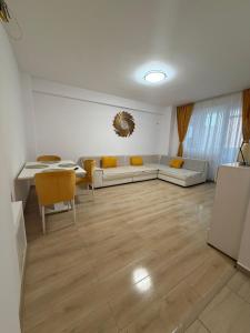 a living room with a couch and a table at RC RelaxApart 314 in Dudu +19 photos